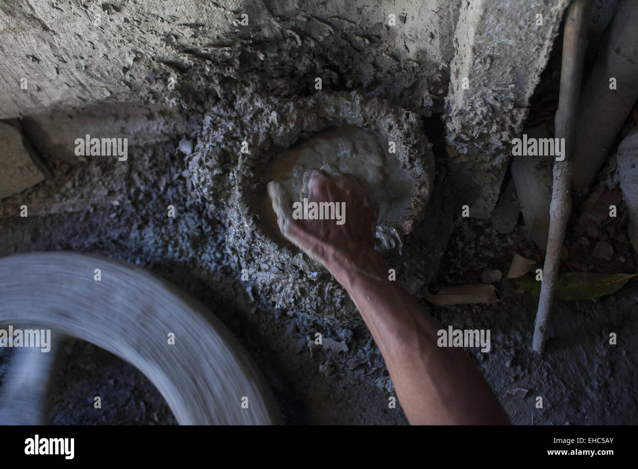 Dhaka, Bangladesh. 11th Mar, 2015.Potter making pots using clay near