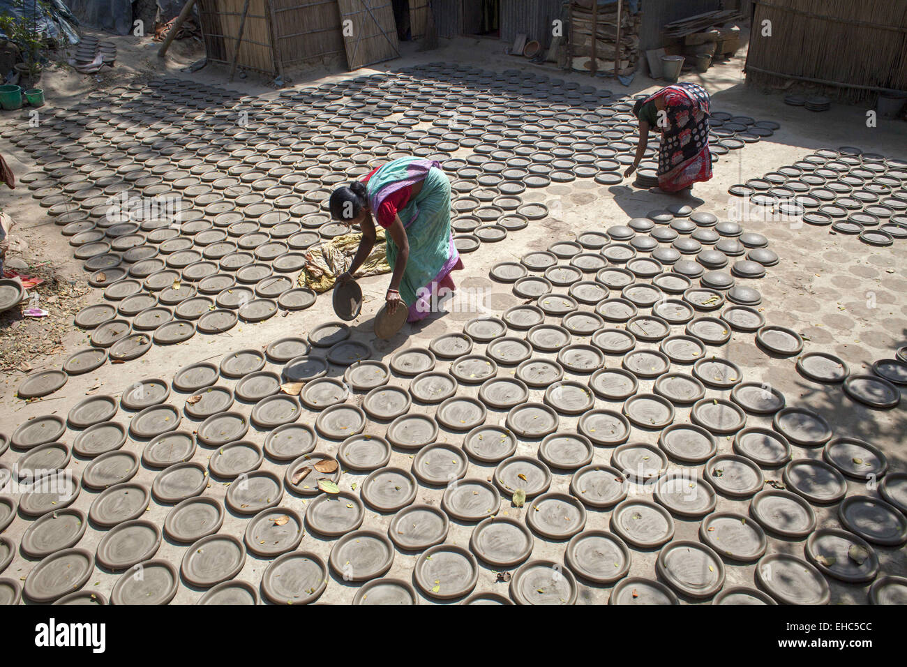 Dhaka, Bangladesh. 11th Mar, 2015.Potter making pots using clay near