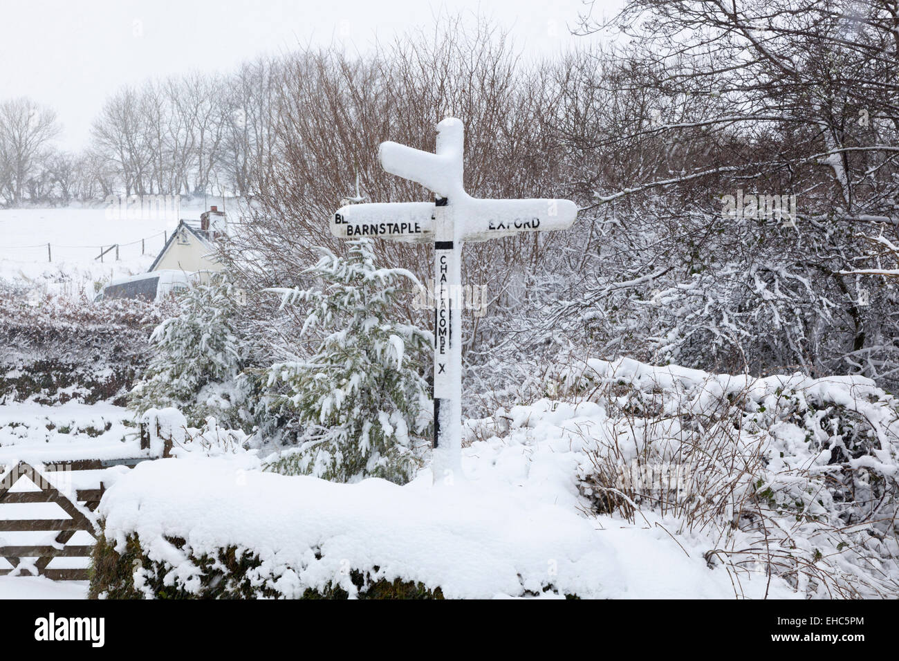 Snow covered country and signpost at on Exmoor in Devon