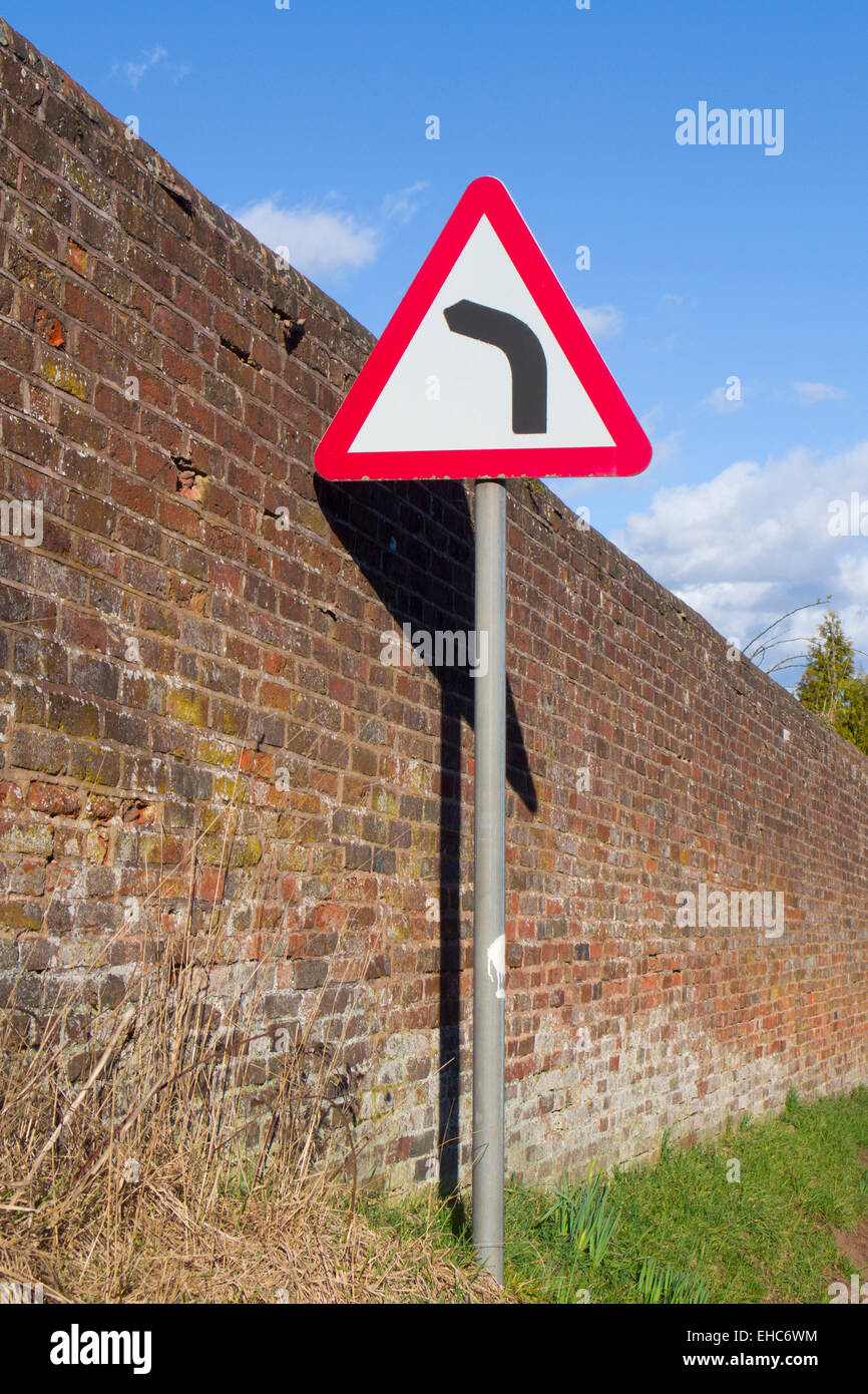 Left Hand Bend Hazard Road Sign, UK Stock Photo
