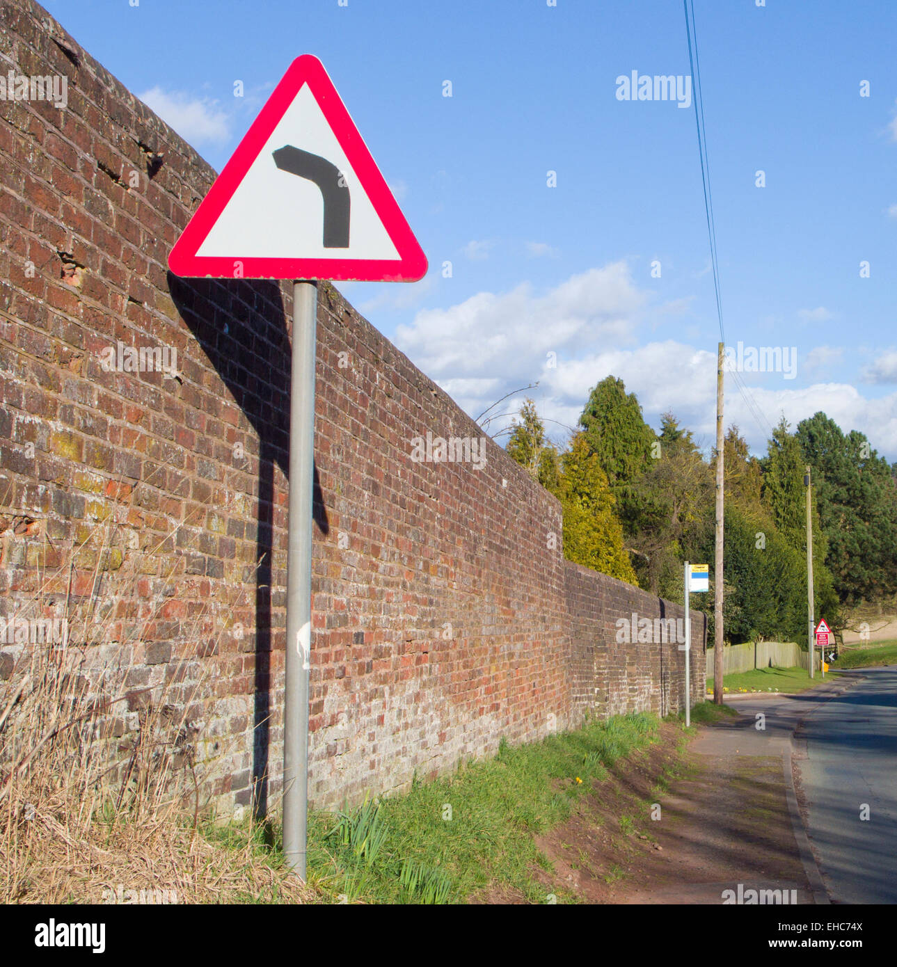 Left Hand Bend Hazard Road Sign, UK Stock Photo
