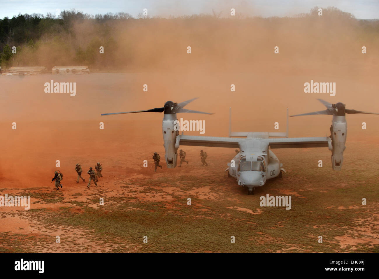 US Air Force Pararescue Jumpers and Combat Rescue Officers from the 920th Rescue Wing conduct joint training with a Marine Osprey tilt-rotor aircraft at the Guardian Center training facility March 11, 2015 in Perry, Georgia. Stock Photo