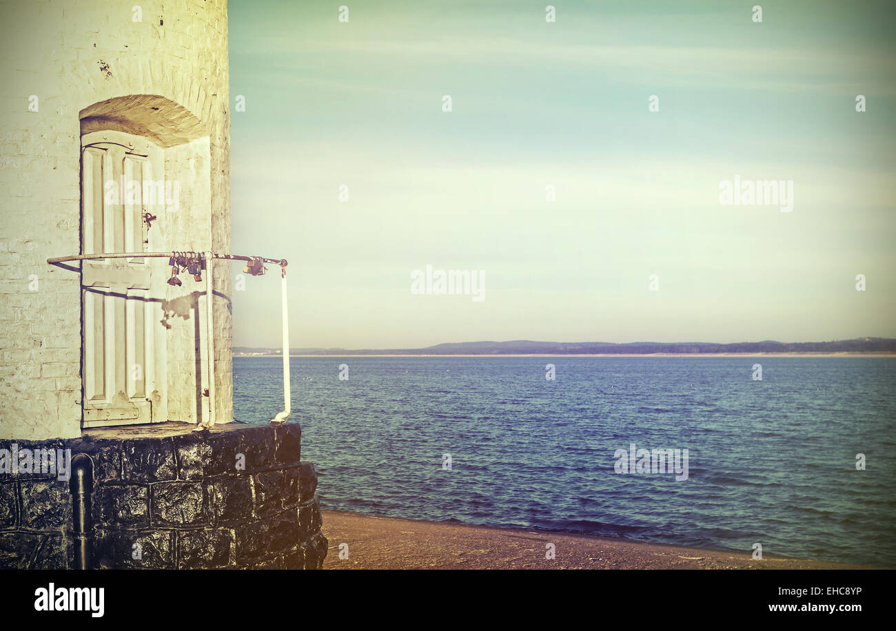 Retro filtered picture of door to the old lighthouse, concept picture. Stock Photo