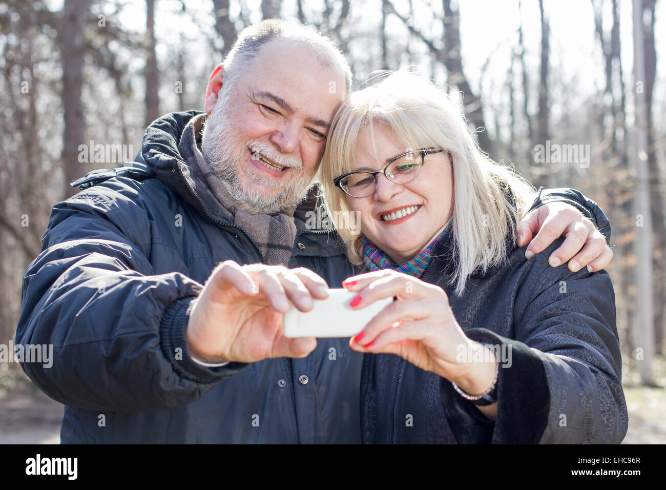 Happy Senior Elderly Couple taking Selfie with phone outdoor.Old people ...