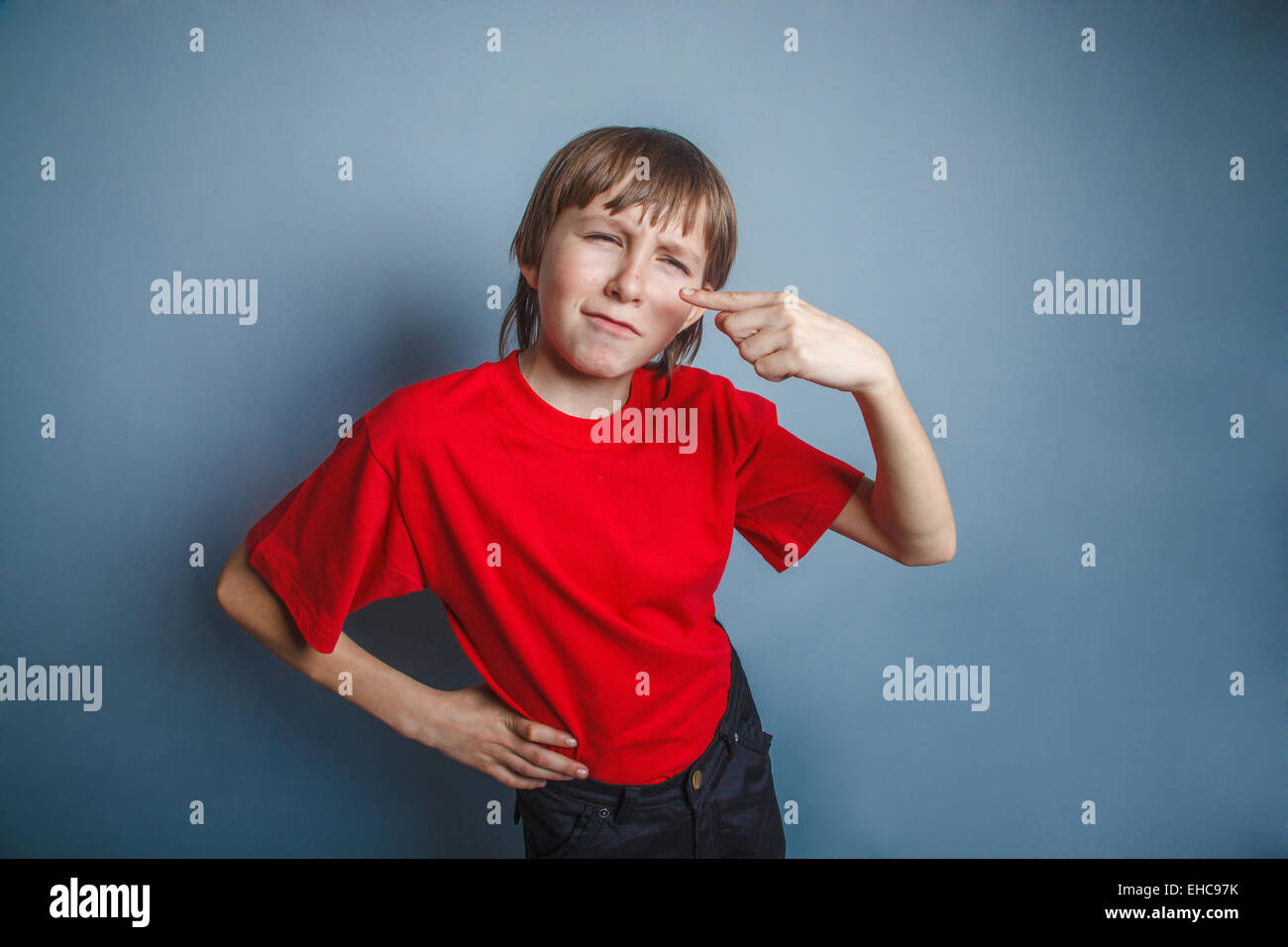 boy, teenager, twelve years in the red shirt, nose pimple proble Stock Photo