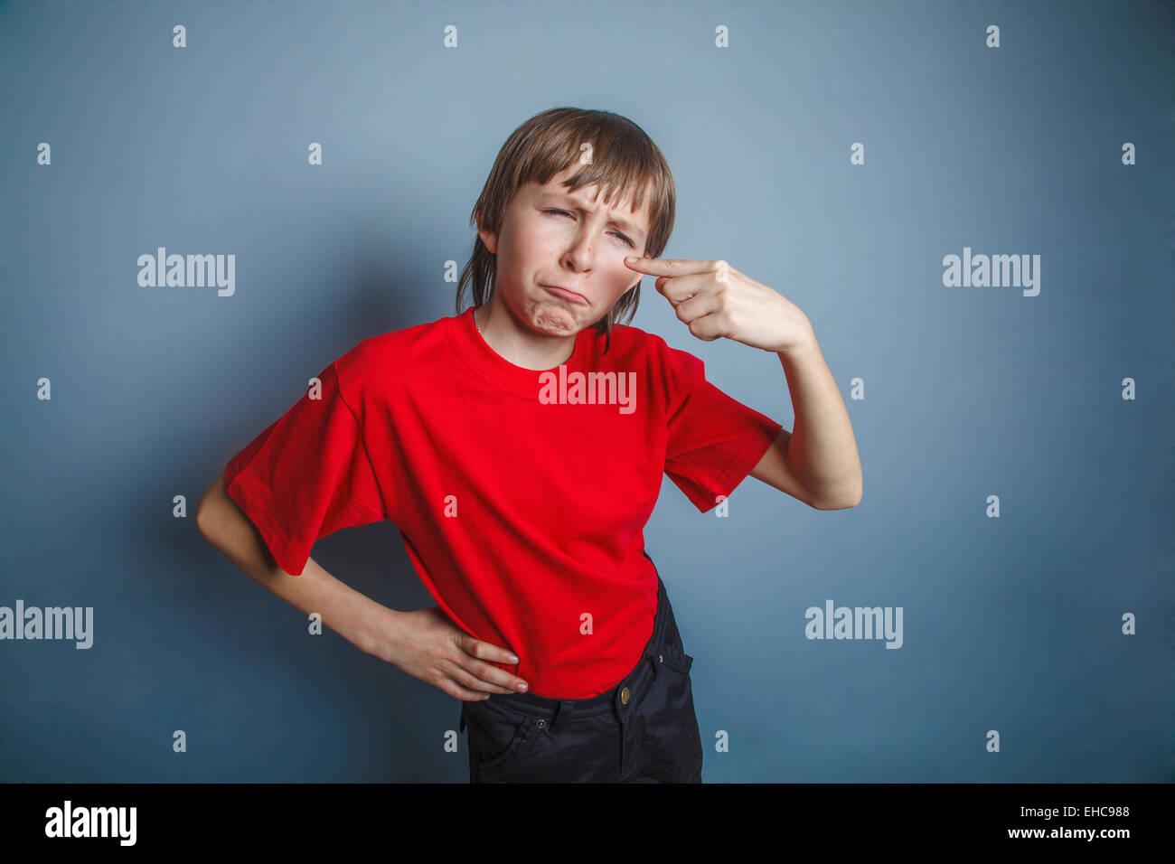 boy, teenager, twelve years in  red shirt, nose pimple problem s Stock Photo