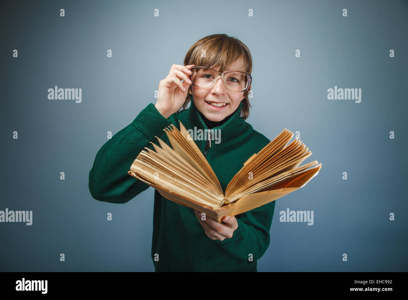 boy teenager European appearance in retro dress with glasses rea Stock Photo