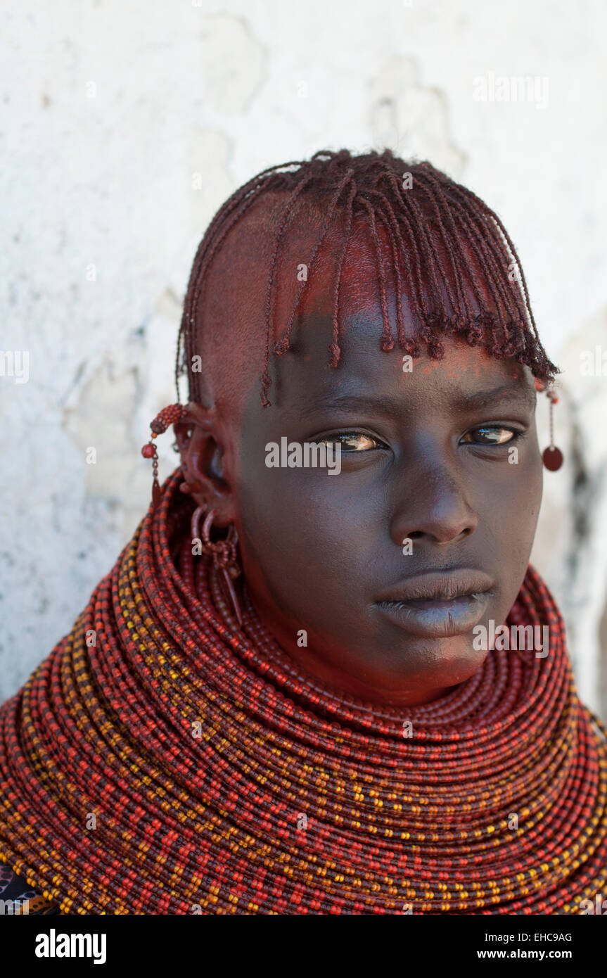 Turkana young woman with massive beaded necklaces and traditional hairstyle, Loiyangalani, Kenya Stock Photo