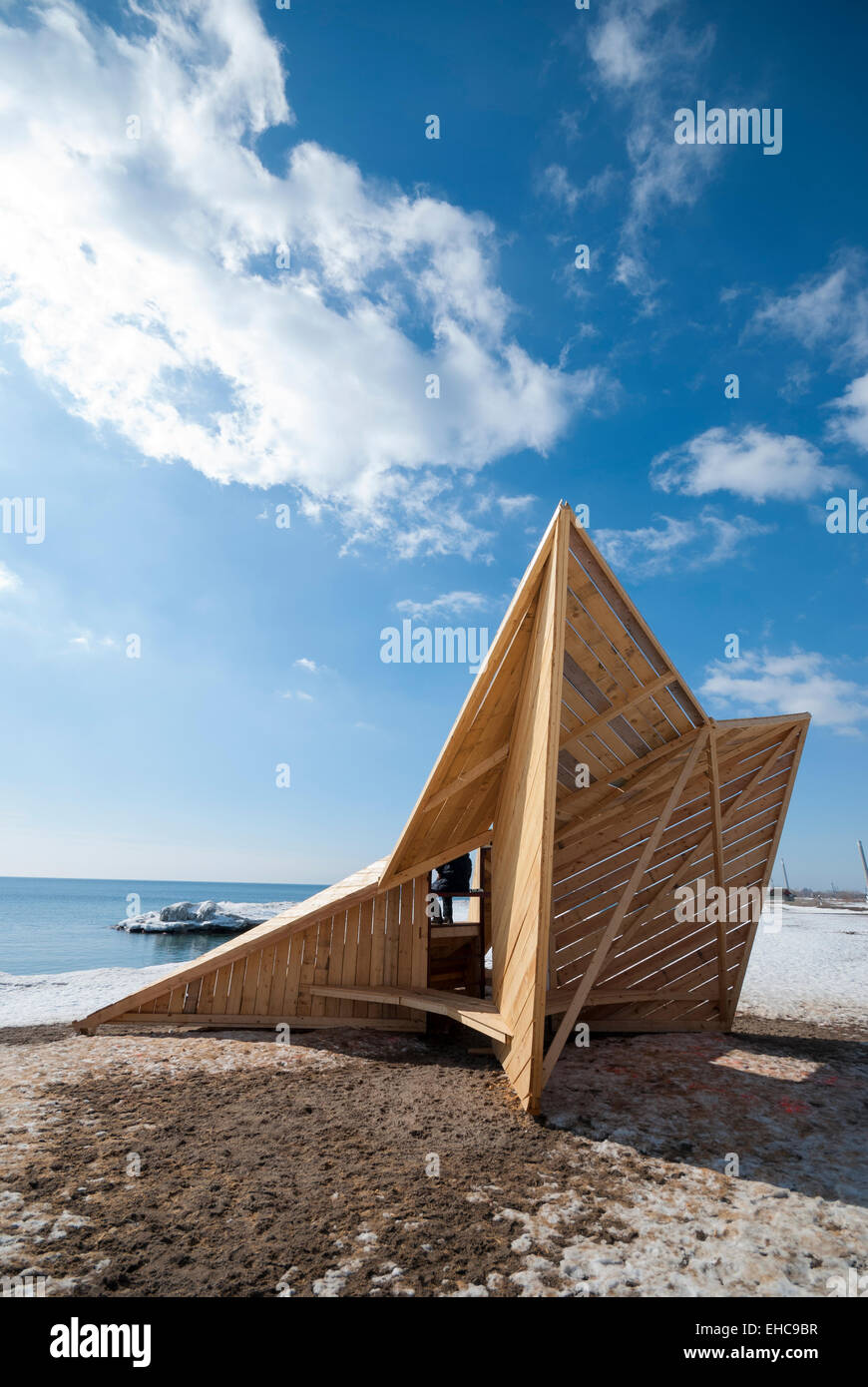 A temporary wooden warming hut one of five installations that are part of an outdoor winter beach art exhibit in Toronto Canada Stock Photo