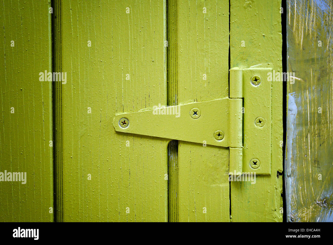 Yellow door hinge Stock Photo