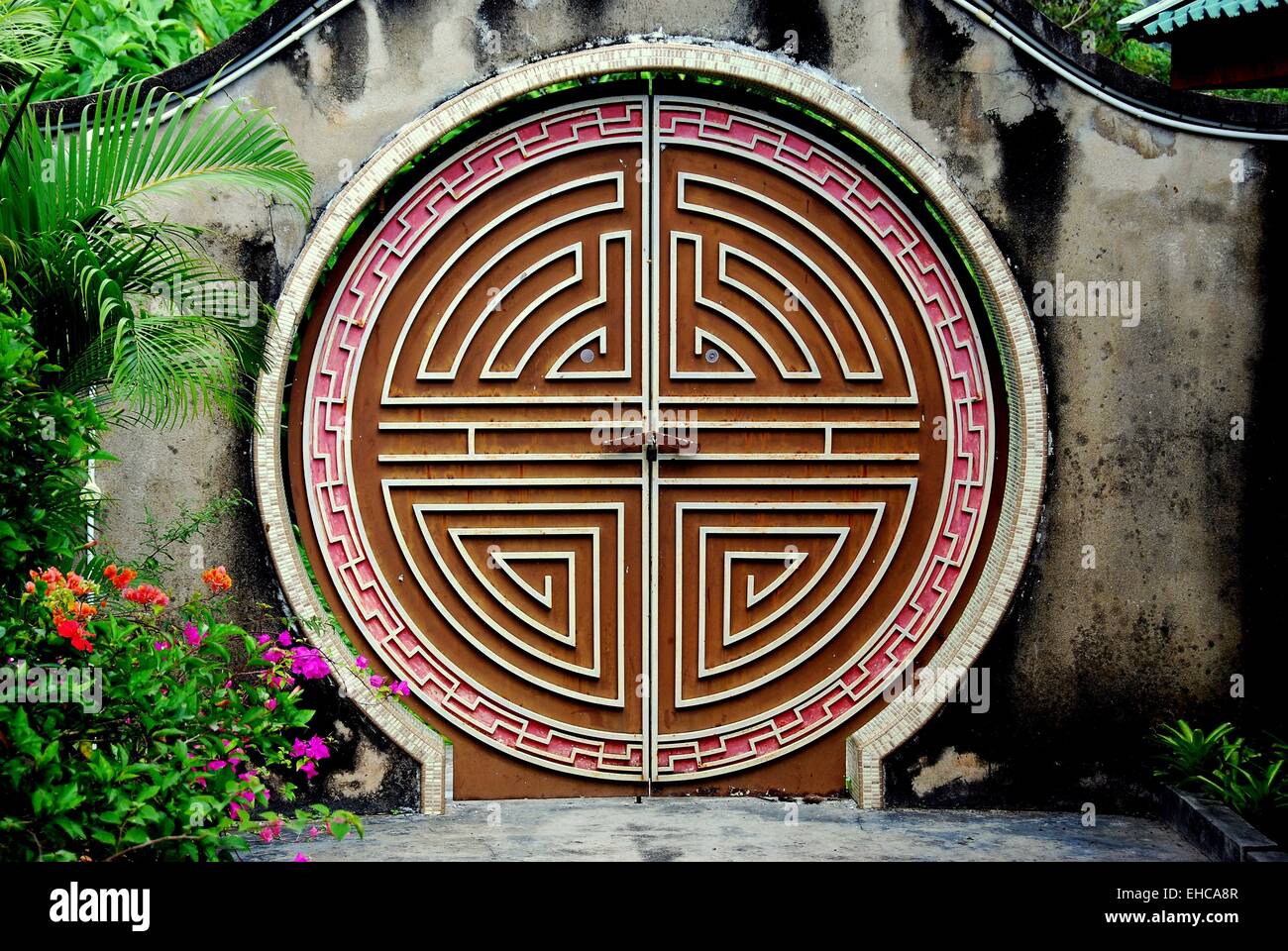 Penang, Malaysia:  A labyrinth moon gate doorway in the gardens at the Snake Temple on Penang Island  * Stock Photo