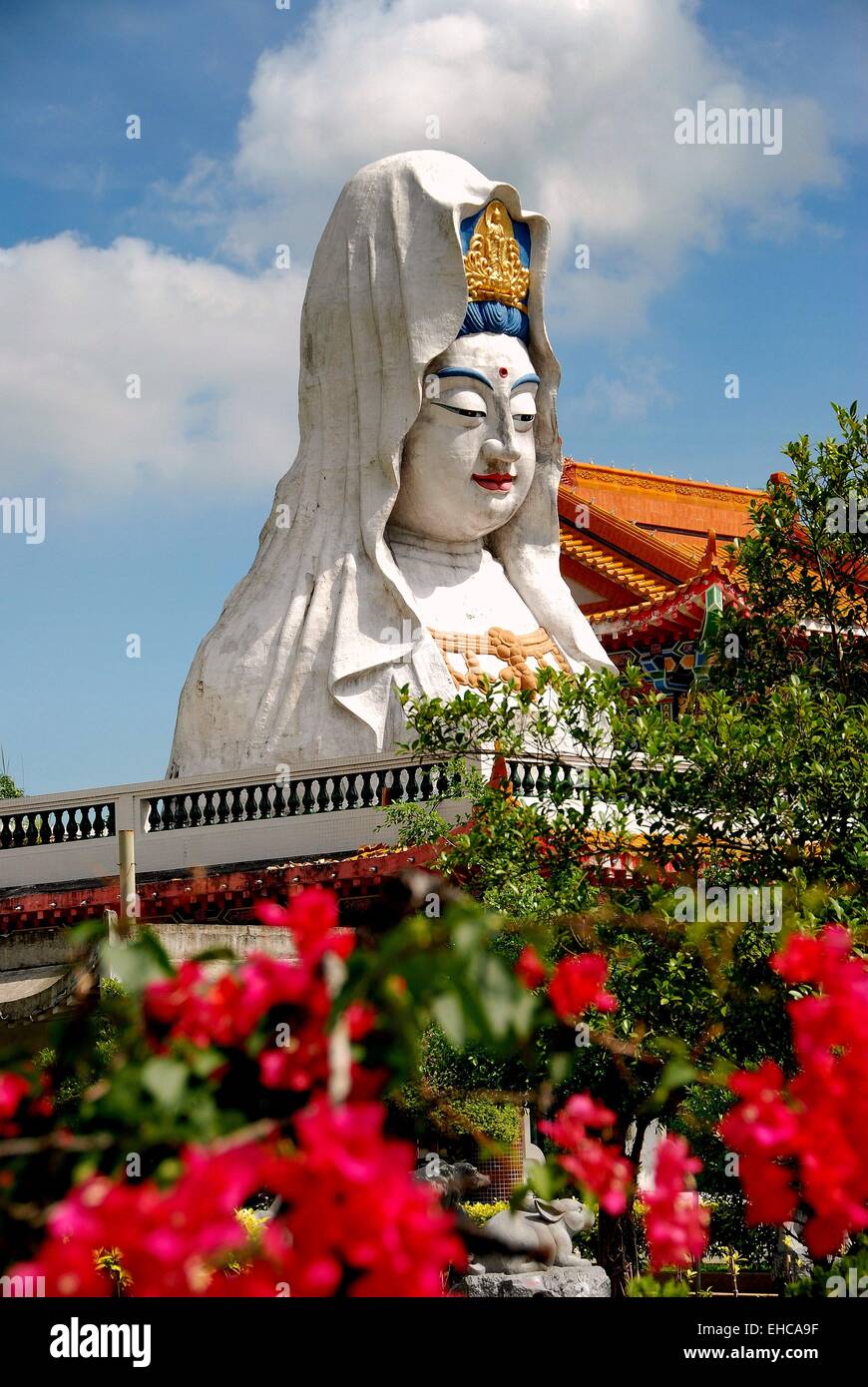 Penang, Malaysia An immense Guan Yin Buddha statue and red