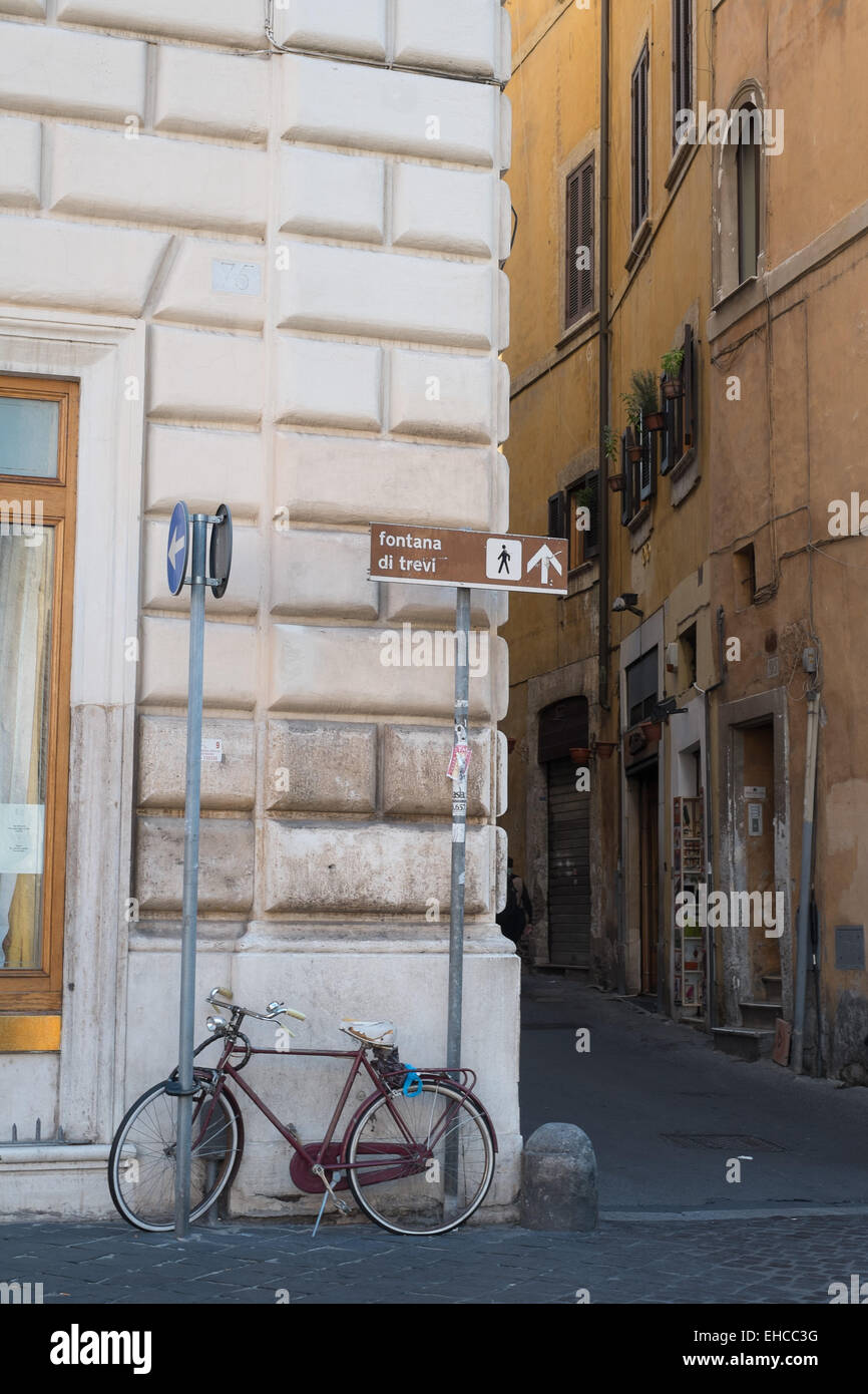 Bicycle parked on a street in downtown Rome Italy. Stock Photo