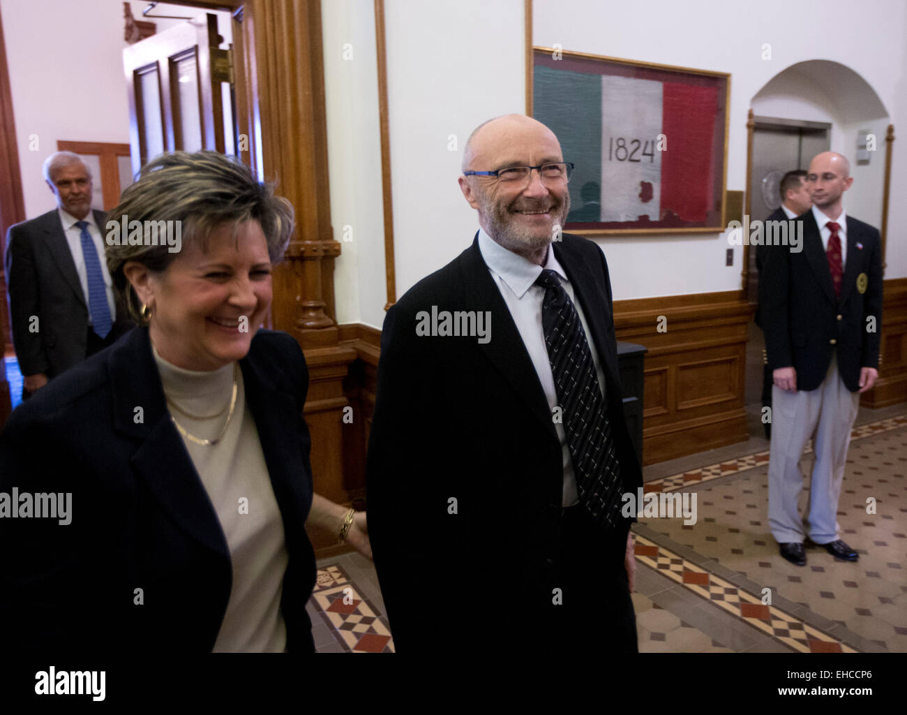 British pop singer Phil Collins with Alamo director after he accepted title of Honorary Texan from the Texas Legislature Stock Photo