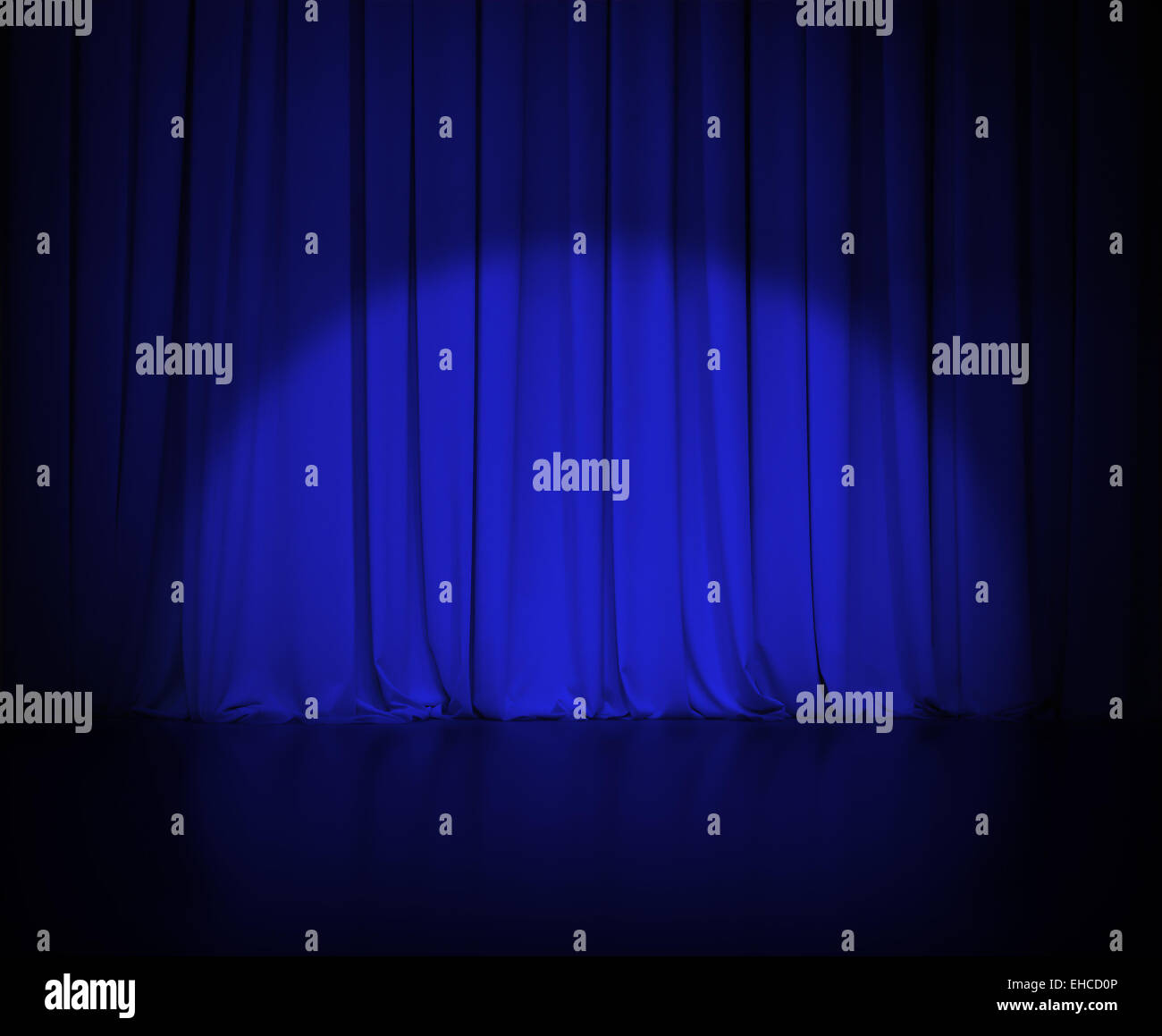 Theatre Dark Blue Curtain Or Drapes With Light Spot Stock Photo