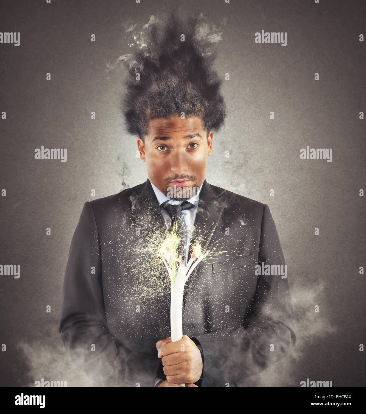 Businessman electrocuted Stock Photo