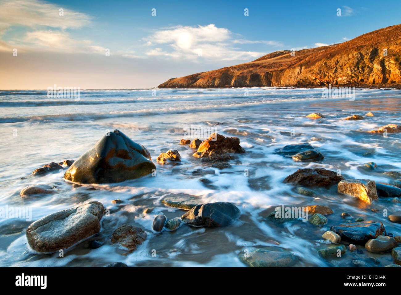 Glorious Light at Church Bay (or Porth Swytan), Anglesey, North Wales, UK Stock Photo