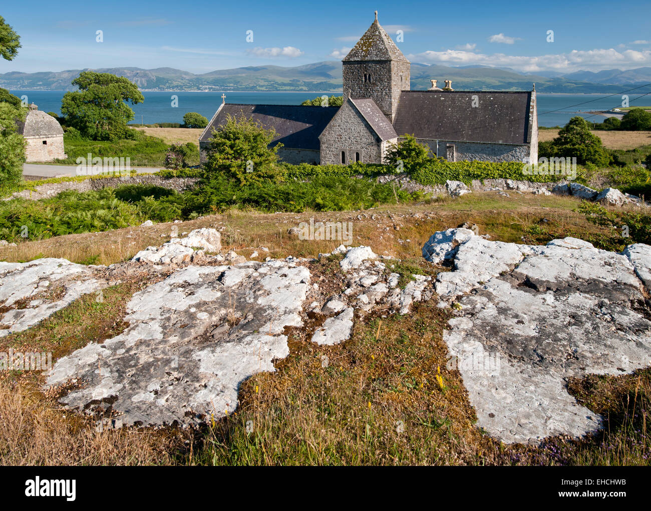 Penmon Priory and the Menai Straits, Near Beaumaris, Anglesey, North Wales, UK Stock Photo