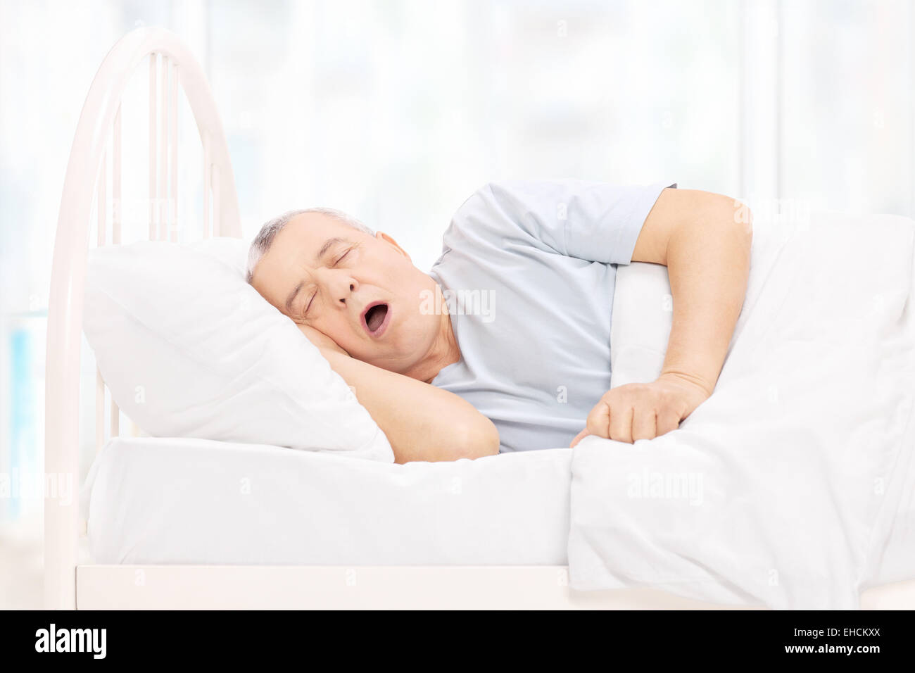 Old man sleeping in bed hi-res stock photography and images - Alamy