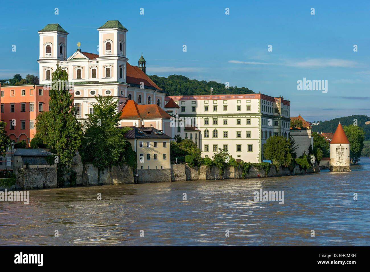 Jesuit Church of St. Michael, Schaiblingsturm tower, flooded promenade of the Inn river during high water, Innkai waterfront Stock Photo