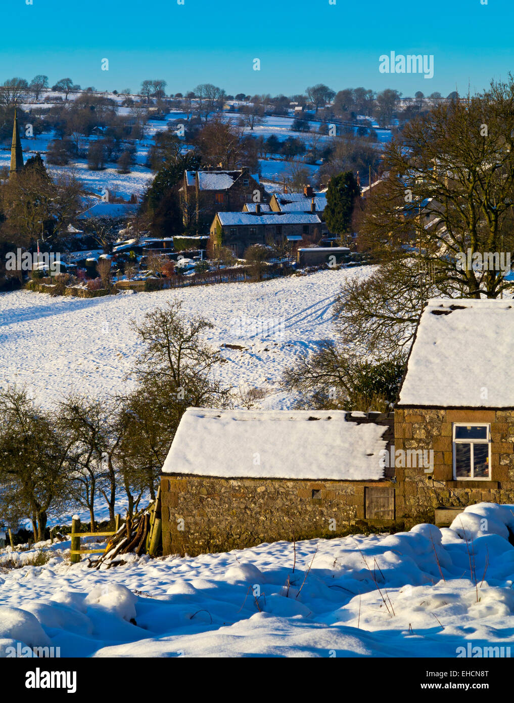 Snow covered landscape with fields and trees near Bonsall close to the Peak District National Park Derbyshire Dales England UK Stock Photo