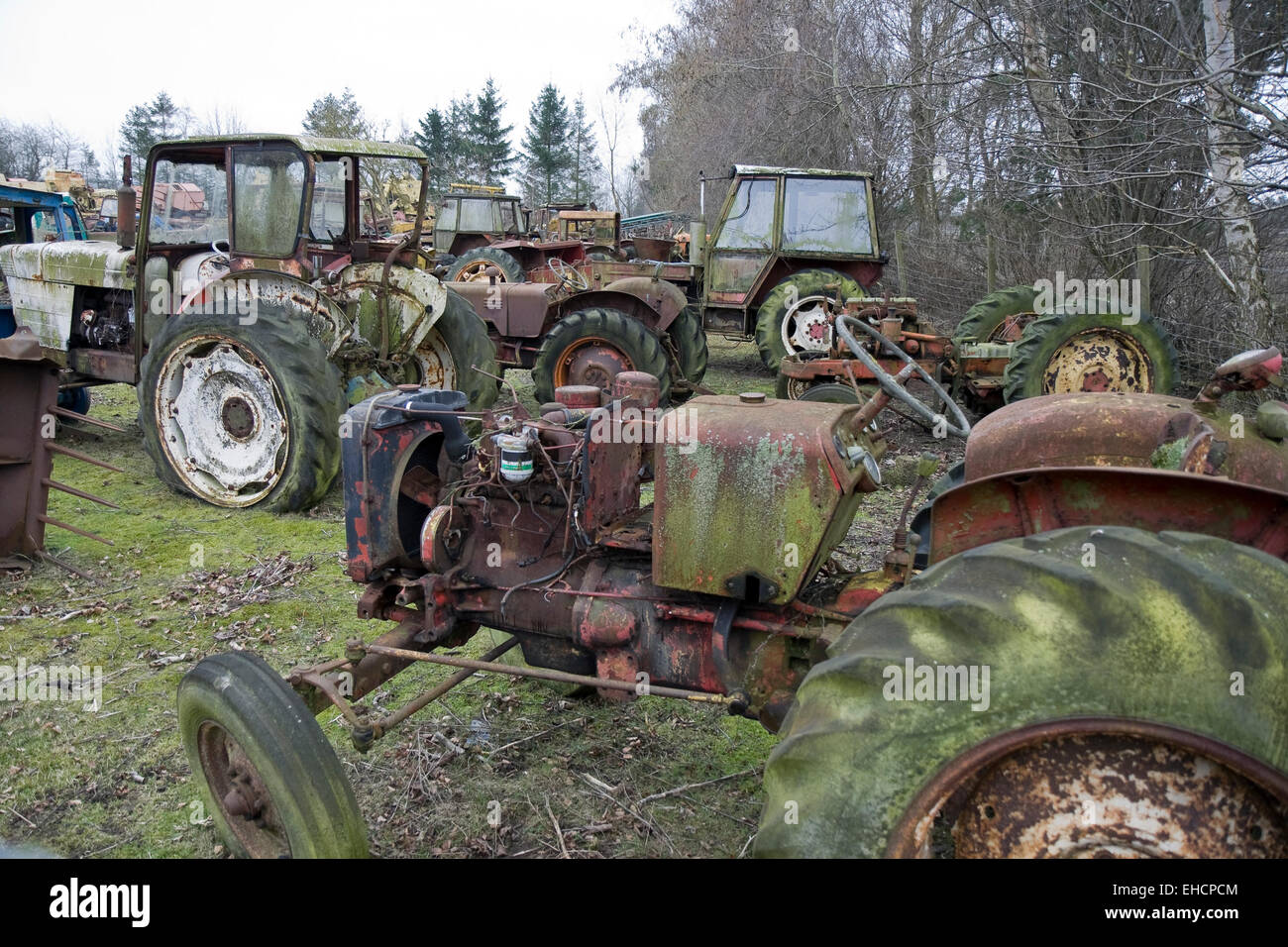 Old tractors on a scrap yard in Jutland, Denmark Stock Photo Alamy