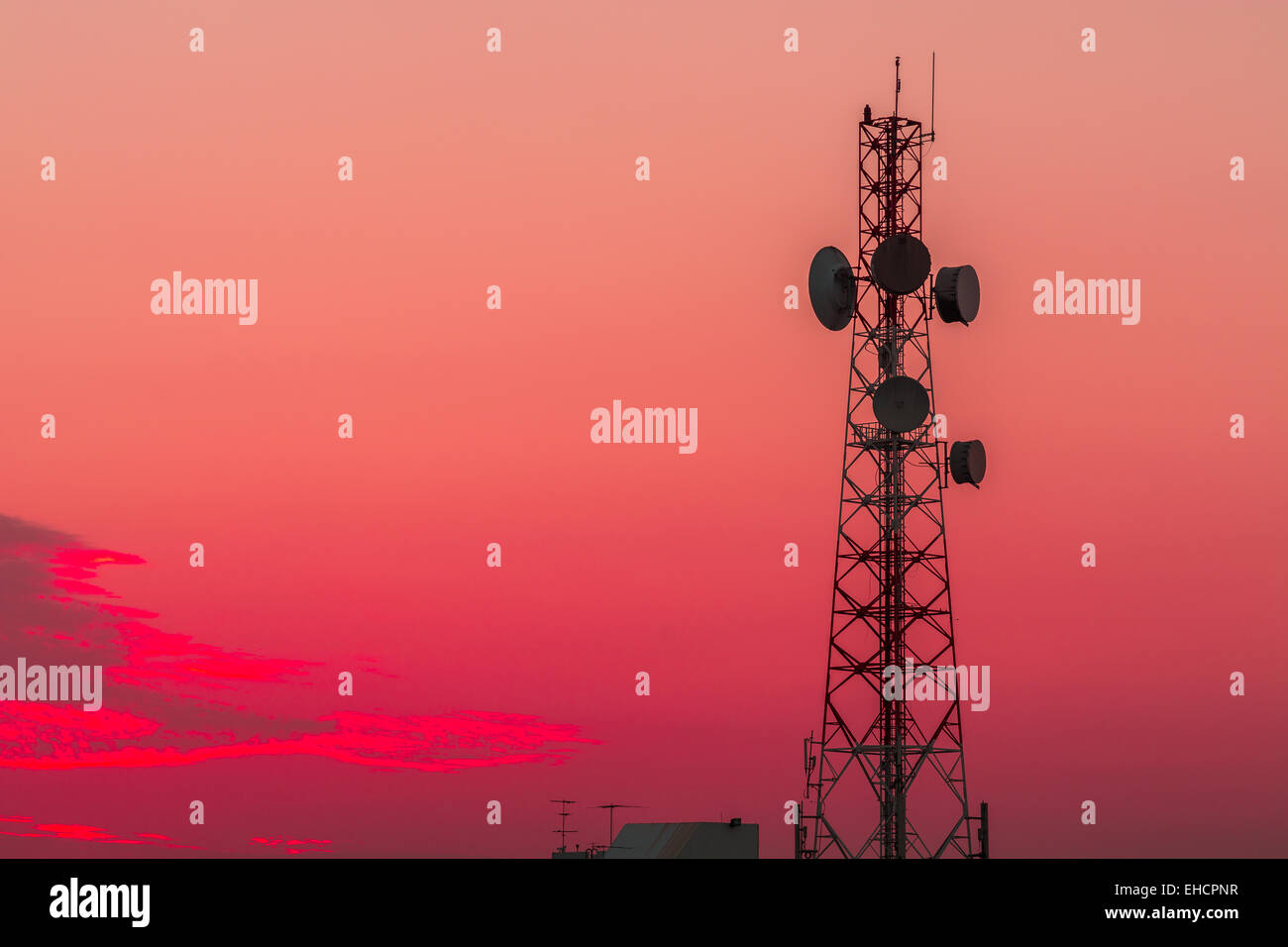 Telecommunication tower structure with sunset sky background Stock Photo