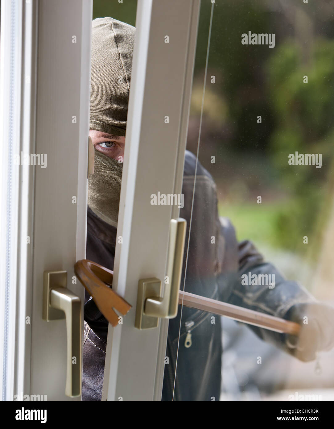 Burglar at a window Stock Photo