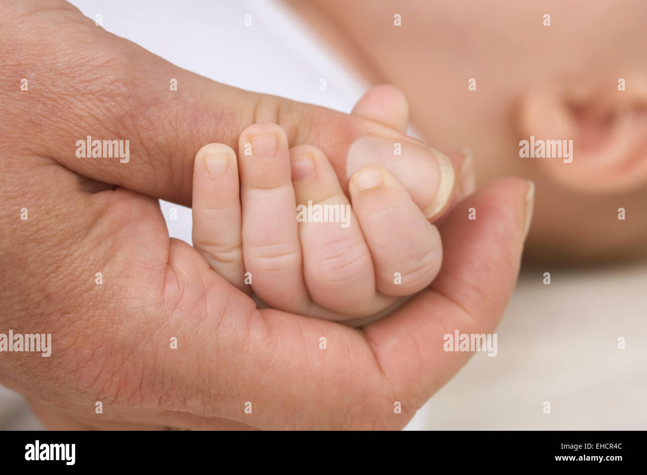 Woman&#39;s hand and Baybfinger Stock Photo