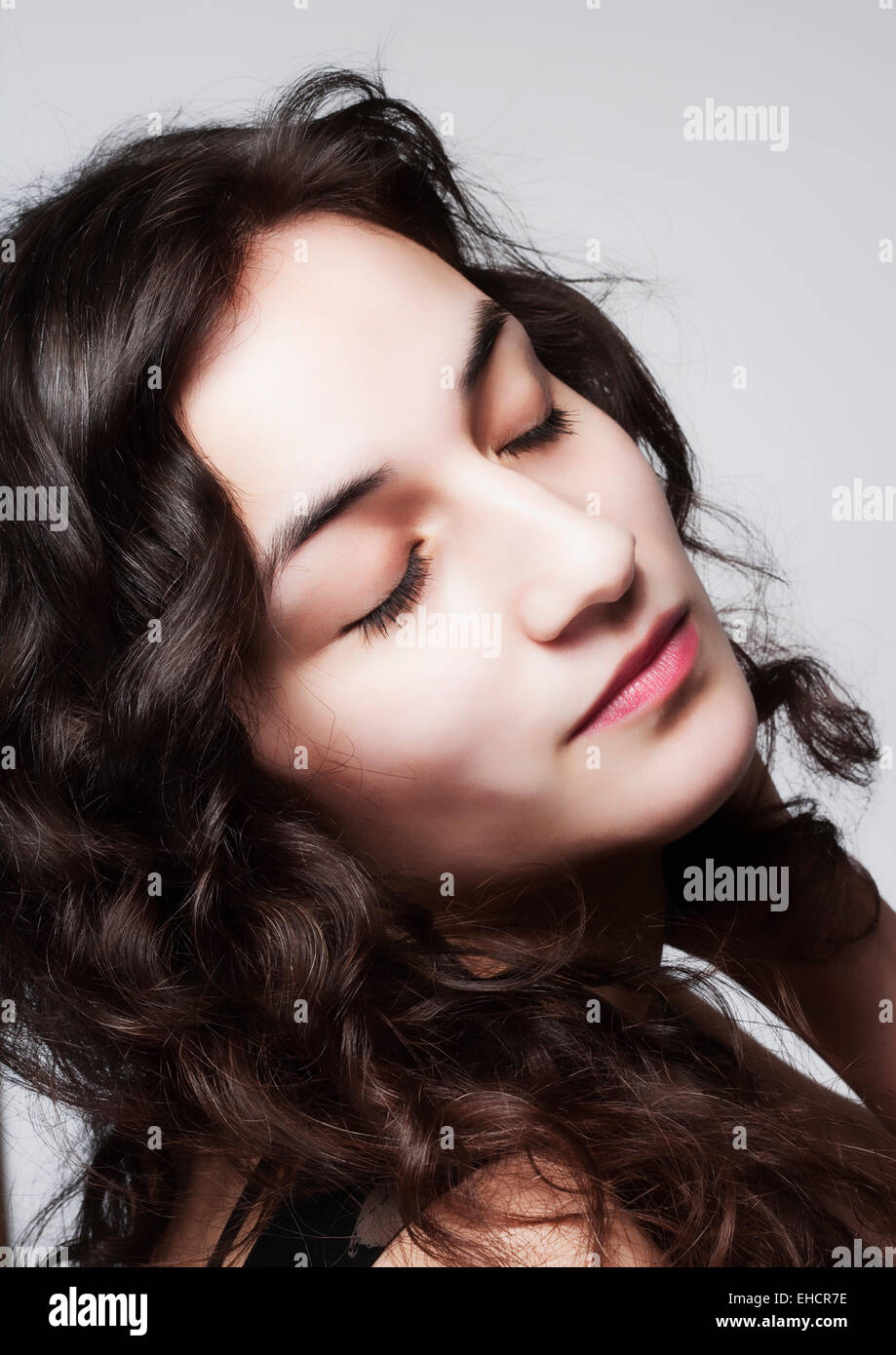 Young Beautiful Woman with Long Brown Hair and Closed Eyes Stock Photo ...