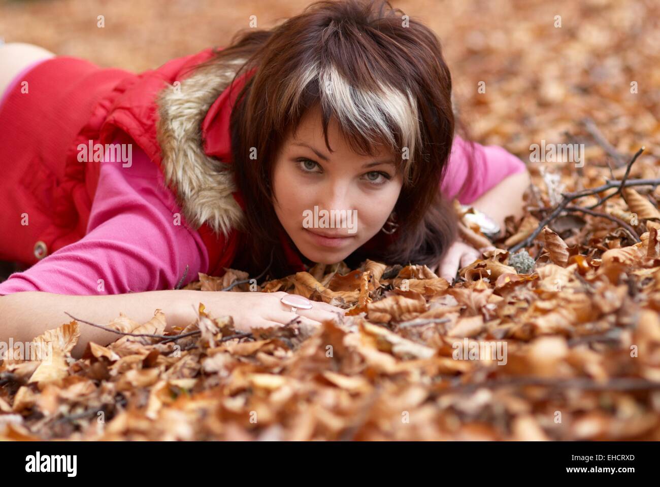 Beautiful girl's portrait with leaves in the autumn park Stock Photo ...
