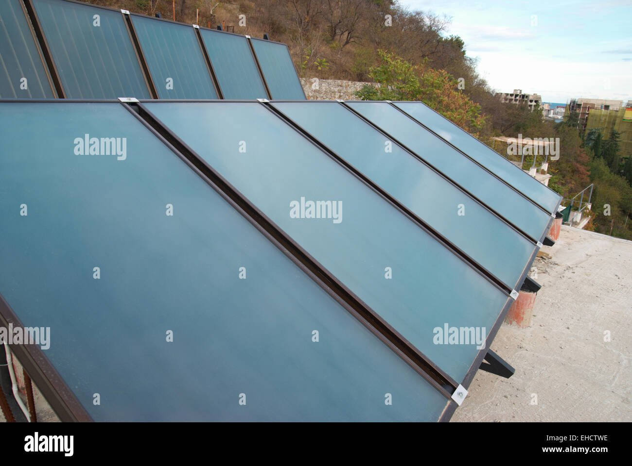 Solar water heating system on the house roof Stock Photo - Alamy