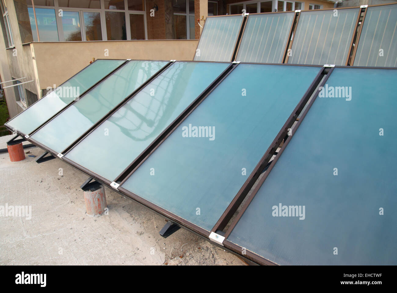 Solar water heating system on the house roof Stock Photo - Alamy