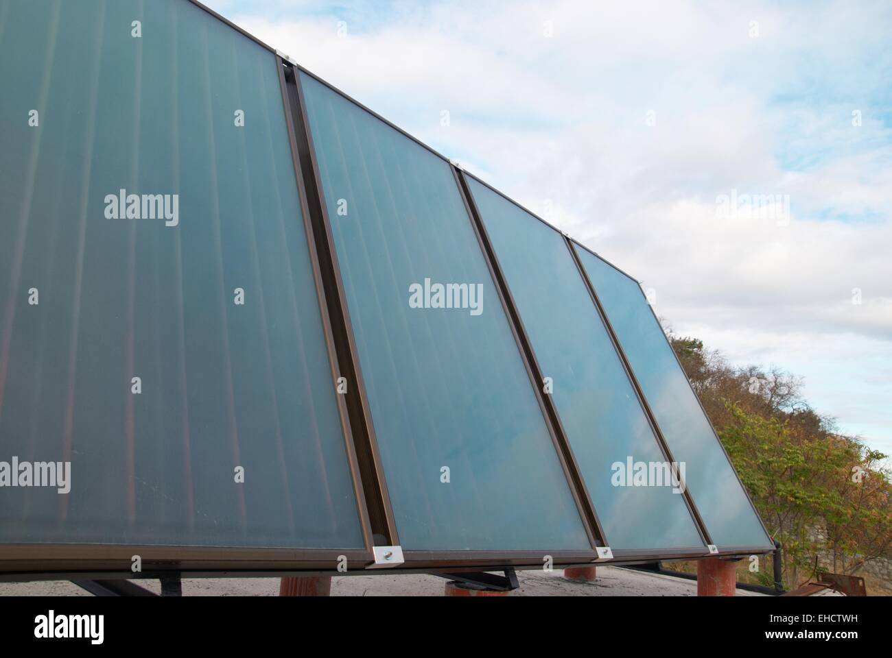 Solar water heating system on the house roof Stock Photo - Alamy