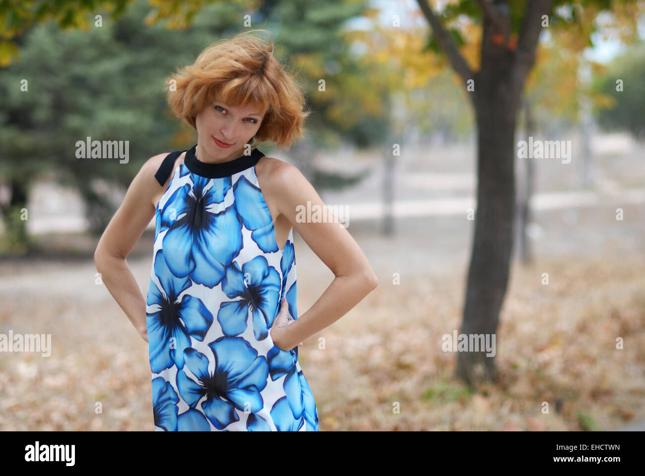 Young woman walking in autumn park, soft background Stock Photo - Alamy