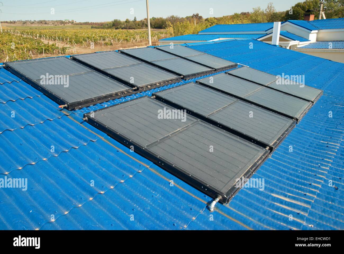 Solar water heating system on the house roof Stock Photo - Alamy