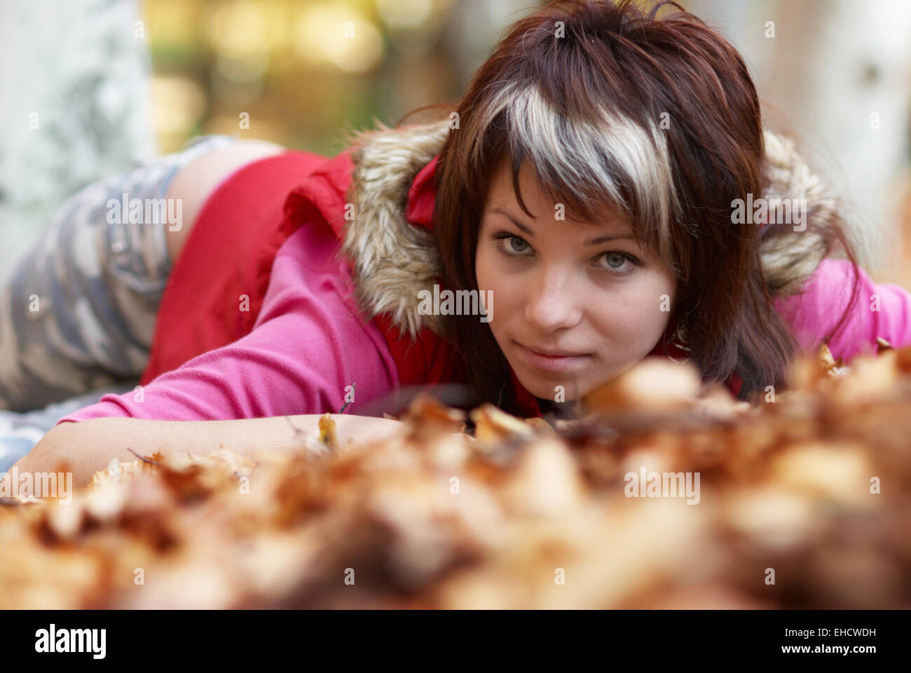 Beautiful girl's portrait with leaves in the autumn park Stock Photo ...