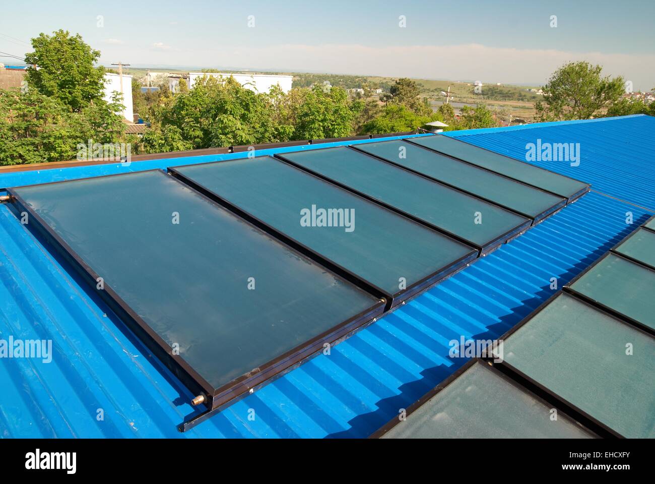 Solar water heating system on the house roof Stock Photo - Alamy
