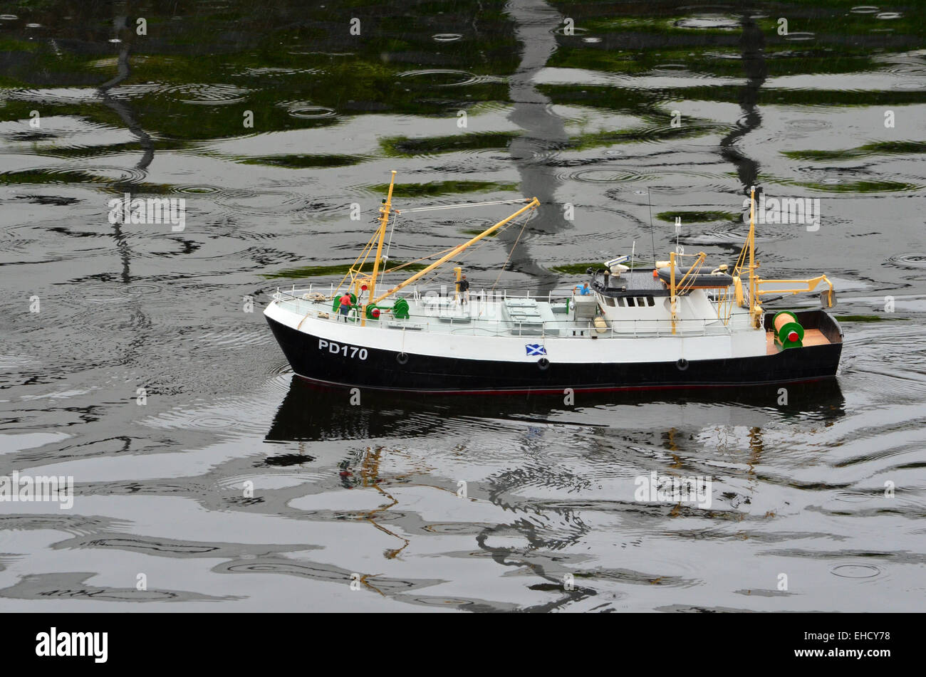 Remote controlled model Police boat sailing in the duck pond at Dalmuir Park, Dalmuir, Clydebank, Scotland Stock Photo