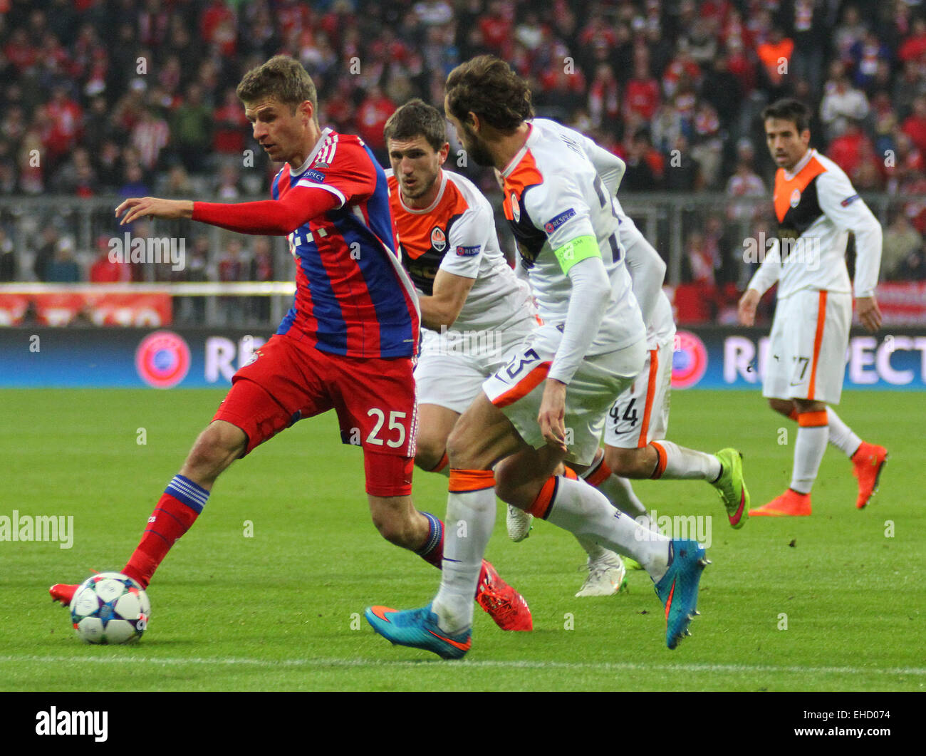 Munich, Germany. 11th Mar, 2015. Bayern Munich's forward Thomas Muller runs with the ball at the Shakhtar defence during the UEFA Champions League match between Bayern Munich and FC Shakhtar Donetsk. March 11, 2015 in Munich, Germany. Credit:  Mitchell Gunn/ESPA/Alamy Live News Stock Photo