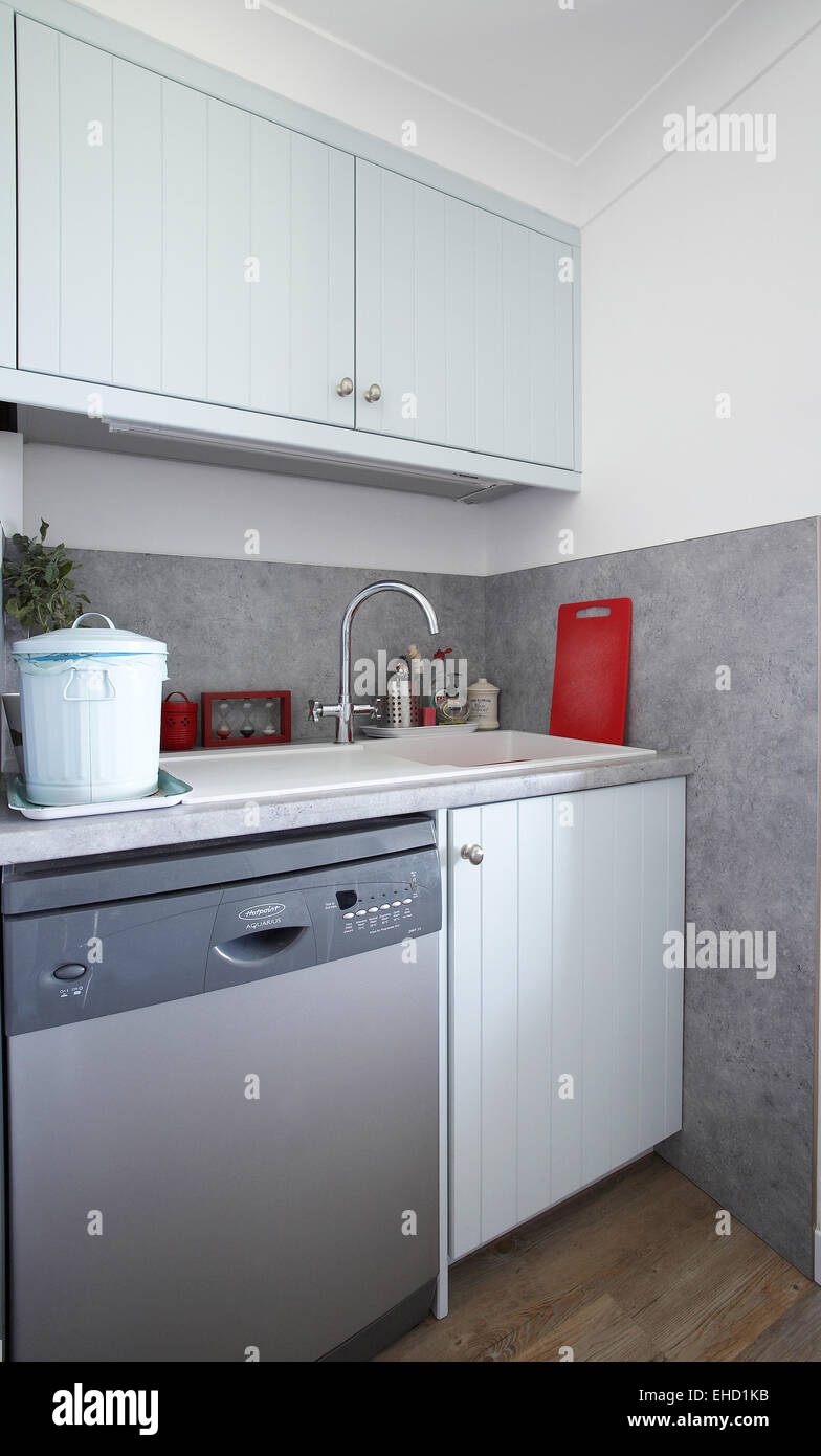 Utility room with sink and dishwasher in a UK home Stock Photo Alamy