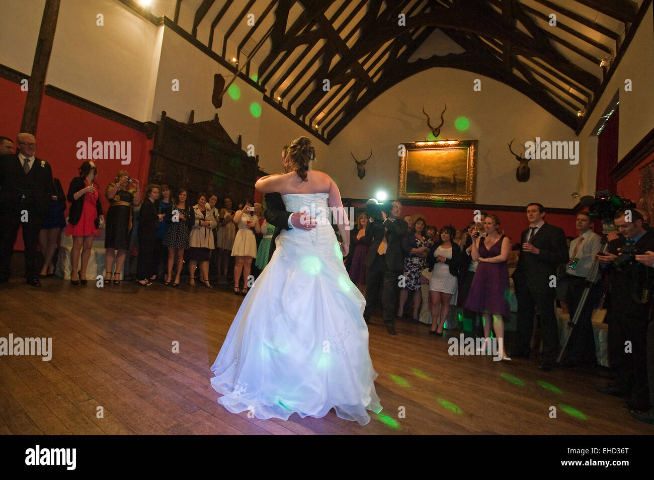 Horizontal portrait of a newly married couple having a traditional first dance together. Stock Photo