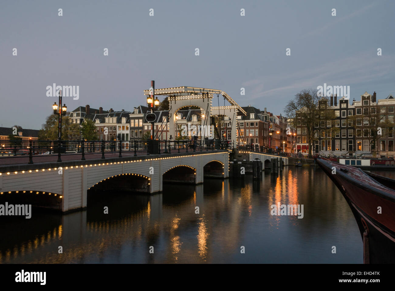 The Magere Brug or Skinny Bridge is a landmark in Amsterdam. It spans the river Amstel. Stock Photo