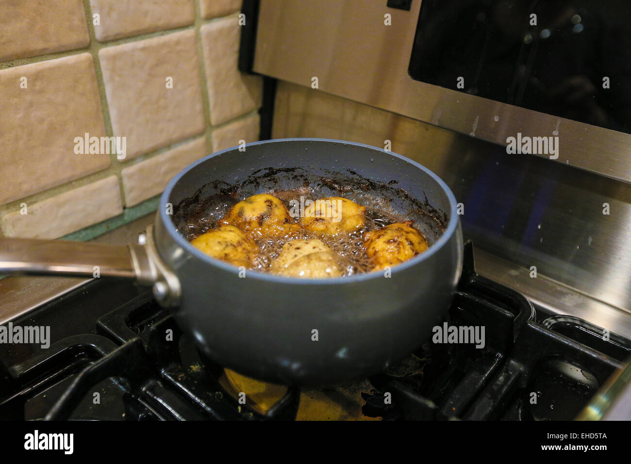 Zeppole are pictured being cooked in New York city Stock Photo - Alamy