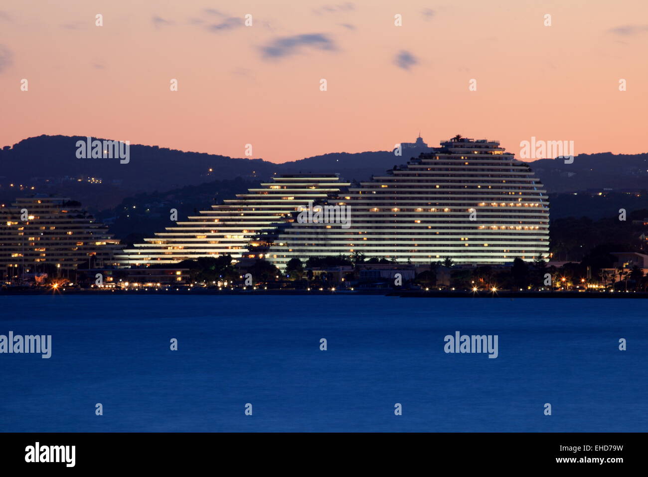 The contemporary architecture of the Marina resort lighted at night Stock Photo