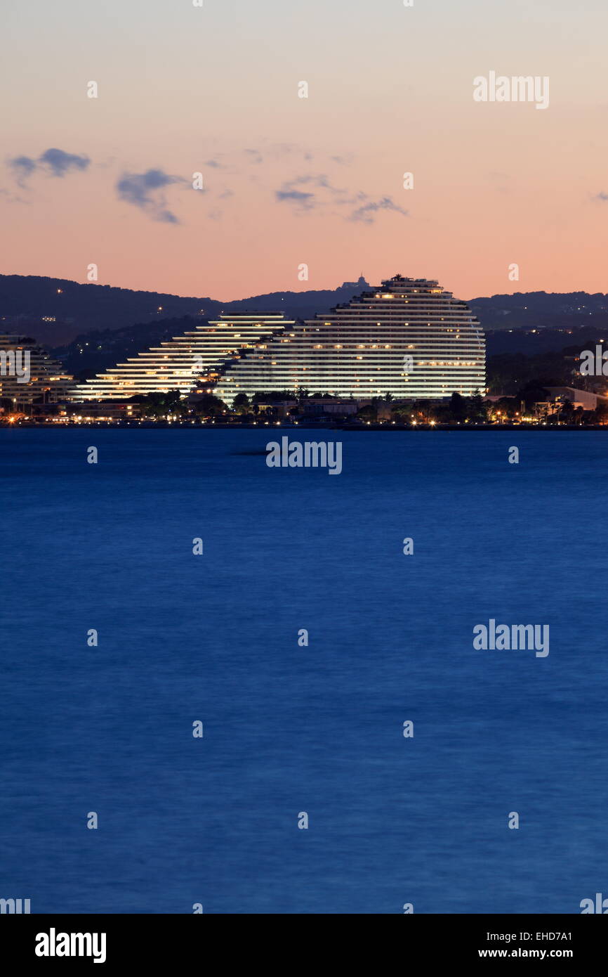 The contemporary architecture of the Marina resort lighted at night Stock Photo