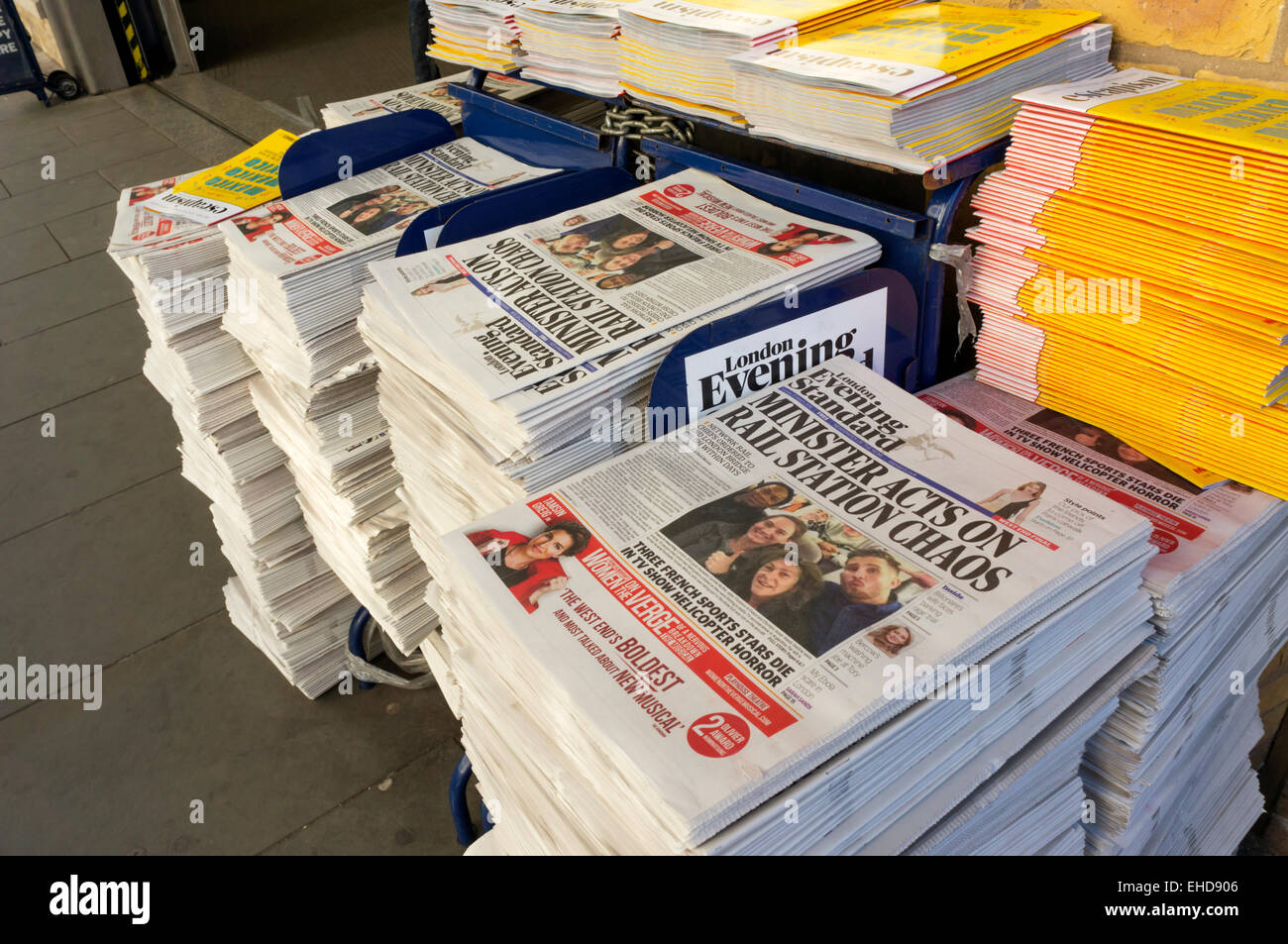 Copies of the Evening Standard outside a London commuter station. Stock Photo