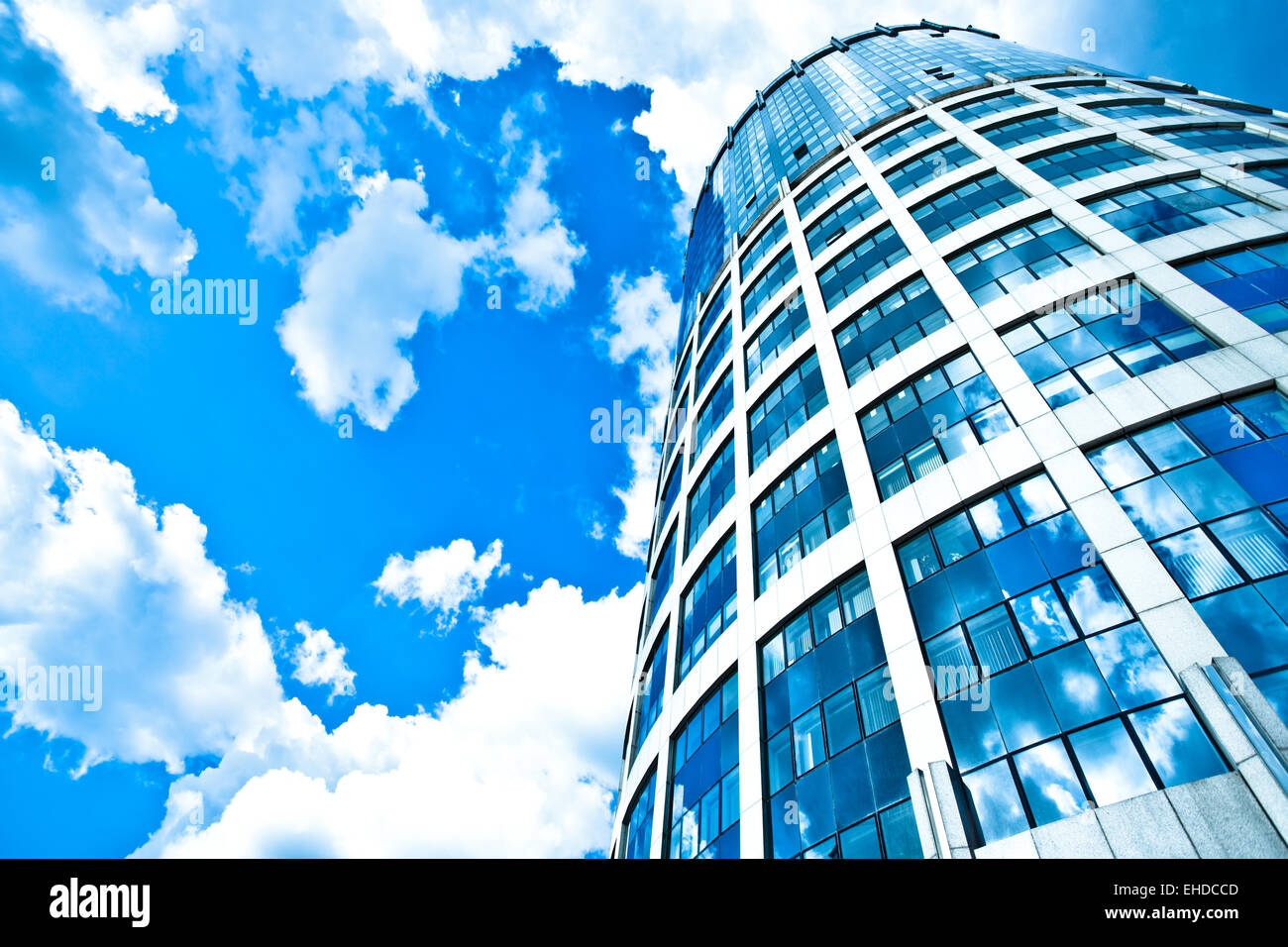 Blue modern office skyscraper on sky Stock Photo - Alamy