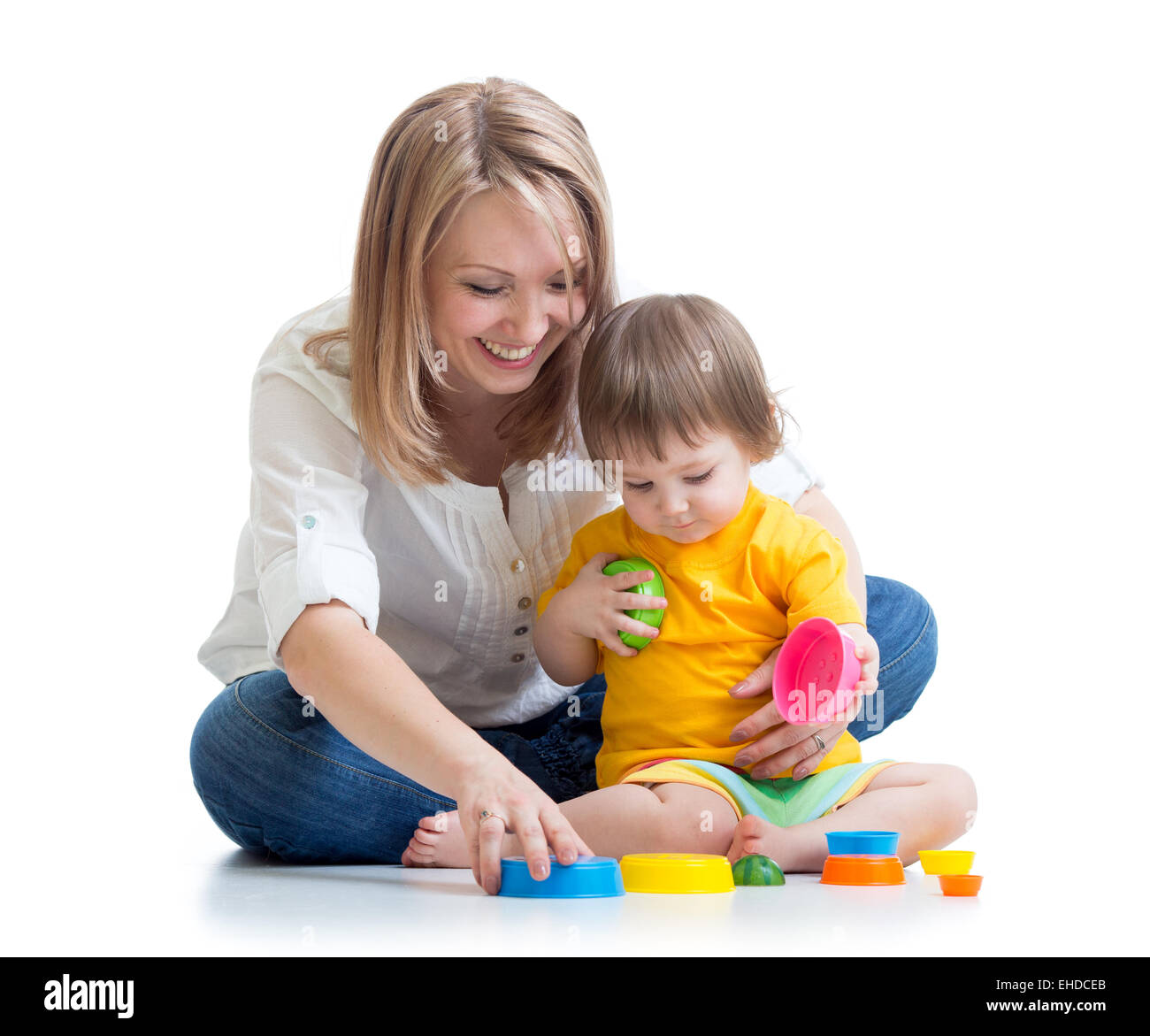 child and mother playing with toys Stock Photo