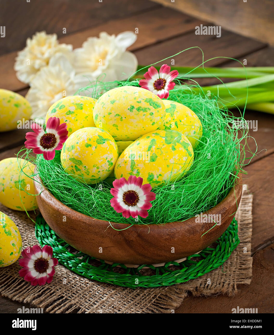Easter eggs and flowers on wooden background Stock Photo - Alamy